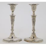 A pair of Victorian silver candlesticks, Sheffield, one 1899 and the other 1900, William Hutton &...