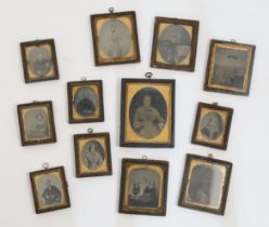 A collection of twelve Victorian daguerreotype photograph portraits, depicting various individual...