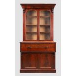 A Victorian mahogany secretaire bookcase, third quarter 19th century, the moulded cornice above t...