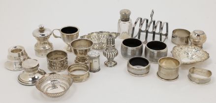 A group of silver cruets and oddments, comprising: a pepperette, Birmingham, 1902, E S Barnsley &...