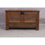 An English oak mule chest, 18th century, the hinged top revealing candle box and storage the heav...