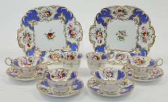 A Coalport part tea service, c.1835, decorated with panels of blue and cream ground and painted w...