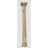 A large Indian painted teak column, 20th century with carved stone base, 272cm high