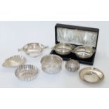 A group of silver bowls and dishes, comprising: a pair of twin handled bowls, Birmingham, 1928, W...