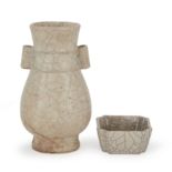 A Chinese guan type vase and a washer 20th century The vase of hu form applied with creamy crac...