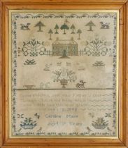 A Victorian needlework sampler by Caroline Mace, aged 7 years, depicting a landscape with a count...