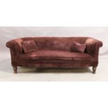 A Victorian mahogany framed chesterfield sofa, last quarter 19th century, purple fabric upholster...