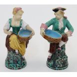 A pair of Minton majolica figures, 1867, impressed MINTON with date code to footrim, modelled as ...
