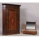 A George III oak corner cabinet, last quarter 18th century, with marquetry shell patera, 103cm hi...