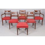 A set of six Regency mahogany bar back dining chairs, first quarter 19th century, brass inlaid, o...