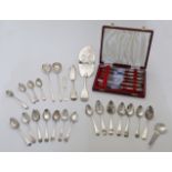 A group of mixed flatware, including: a George IV silver fish slice, London, 1826, maker W E, fid...