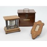 An Edwardian mahogany and glass calendar, designed as a pedestal with four silver plated fluted c...
