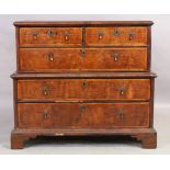 An English walnut chest on chest, 18th century, two short and three long drawers, on bracket feet...