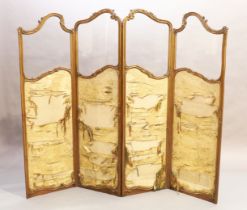 A French parcel gilt carved walnut four fold screen, last quarter 19th century, with floral silk ...
