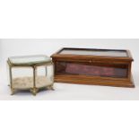 A mahogany rectangular table-top display case, 20th century, with red velvet lining and glazed to...