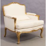 A French giltwood armchair, Louis XV style, 20th century, on cabriole legs