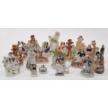 A group of Staffordshire ceramic figures and figure groups, 19th century, comprising: a group of ...