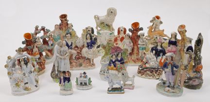 A group of Staffordshire ceramic figures and figure groups, 19th century, comprising: a group of ...