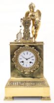 A French Empire style brass mantel clock, 19th century, the case modelled with a winged cherub le...