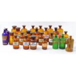 A quantity of apothecary bottles, late 19th / early 20th century, to include two green glass ribb...