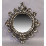 A French cast metal foliate mirror, 20th century, with label for E. Bertonneau, 68cm x 57cm