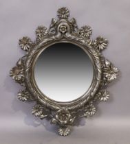 A French cast metal foliate mirror, 20th century, with label for E. Bertonneau, 68cm x 57cm