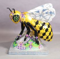 A large resin sculpture of a bee, 'Crown Jewels' designed by Ambrin, c.2018, produced as part of ...