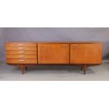 White & Newton, a teak sideboard, c.1960, with an arrangement of six graduated drawers and two cu...