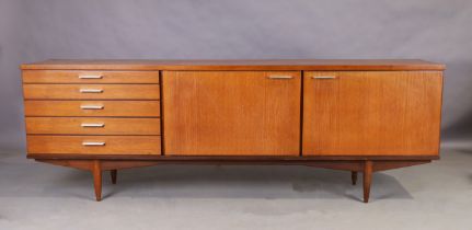 White & Newton, a teak sideboard, c.1960, with an arrangement of six graduated drawers and two cu...