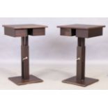 A pair of contemporary side tables, in stained wood, the adjustable height square tops above draw...