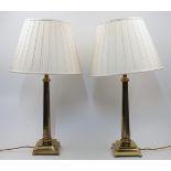 A pair of brass table lamps, 20th century, each of fluted columnar form with stepped base raised ...