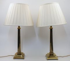 A pair of brass table lamps, 20th century, each of fluted columnar form with stepped base raised ...