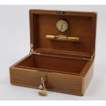 An Elie Bleu walnut cigar humidor, Paris, 20th century, with gilt brass fittings and hinges, hygr...