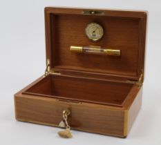 An Elie Bleu walnut cigar humidor, Paris, 20th century, with gilt brass fittings and hinges, hygr...