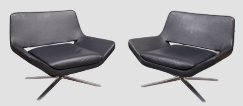 After Jeffrey Bernett, a pair of black leather lounge chairs, on chrome base, each approx. 68 x 6...
