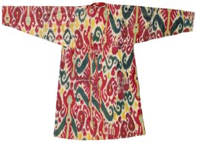 A waxed silk Ikat robe (chapan), possibly Uzbekistan, Central Asia, late 19th-early 20th century,...