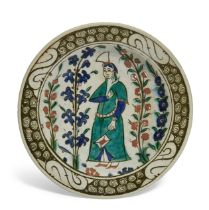 A figural Iznik pottery dish, Ottoman Turkey, circa 1600, of typical form, underglaze decorated i...