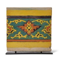 A Mughal cuerda seca border pottery tile, Lahore or Kashmir, India, 17th century, the yellow, ora...