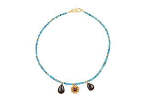 To Be Sold With No Reserve A gold, turquoise and carnelian necklace, strung with a series of tur...