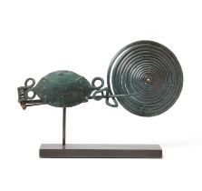 A Central European copper alloy fibula, Bronze Age, circa 10th-7th Century B.C., formed from a si...