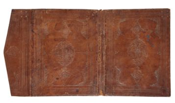 A brown tooled leather binding, Ottoman Turkey, 18th century, the central panel with a lobed meda...