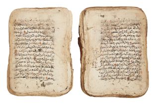 A West African Qur'an, 19th century, Arabic manuscript on paper, unbound, incomplete, with 17 and...