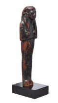 An Egyptian wood shabti, New Kingdom, Ramesside Period, 19th Dynasty, circa 1295-1185 B.C., with ...