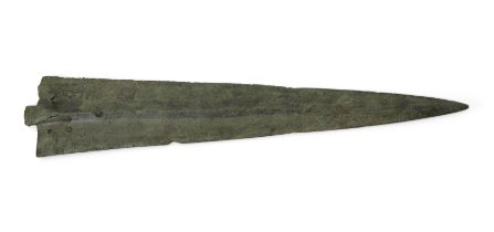 A heavy Bronze Age bronze short sword with leaf-shaped blade and pronounced midrib, cylindrical s...