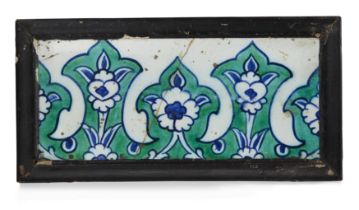 A Damascus Iznik rectangular border pottery tile, Ottoman Syria, 17th century, the blue and green...