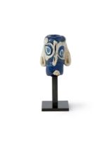 Property from a Private Collection, UK To Be Sold With No Reserve A Phoenician glass comic face...