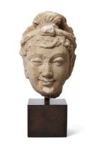 A fragmentary stucco head of a male figure, ancient region of Gandhara, 4th-5th century, moulded ...