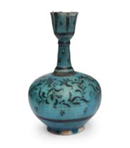 A Kashan turquoise glazed pottery flask, Iran, 13th-14th century, of bulbous form on short foot, ...