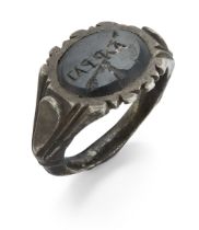 A Roman silver ring with broad engraved shank, the green bezel engraved with lettering, circa 3rd...