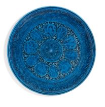 A pottery plate in the Qajar style, Germany or France, 19th century, turquoise glazed, the centra...